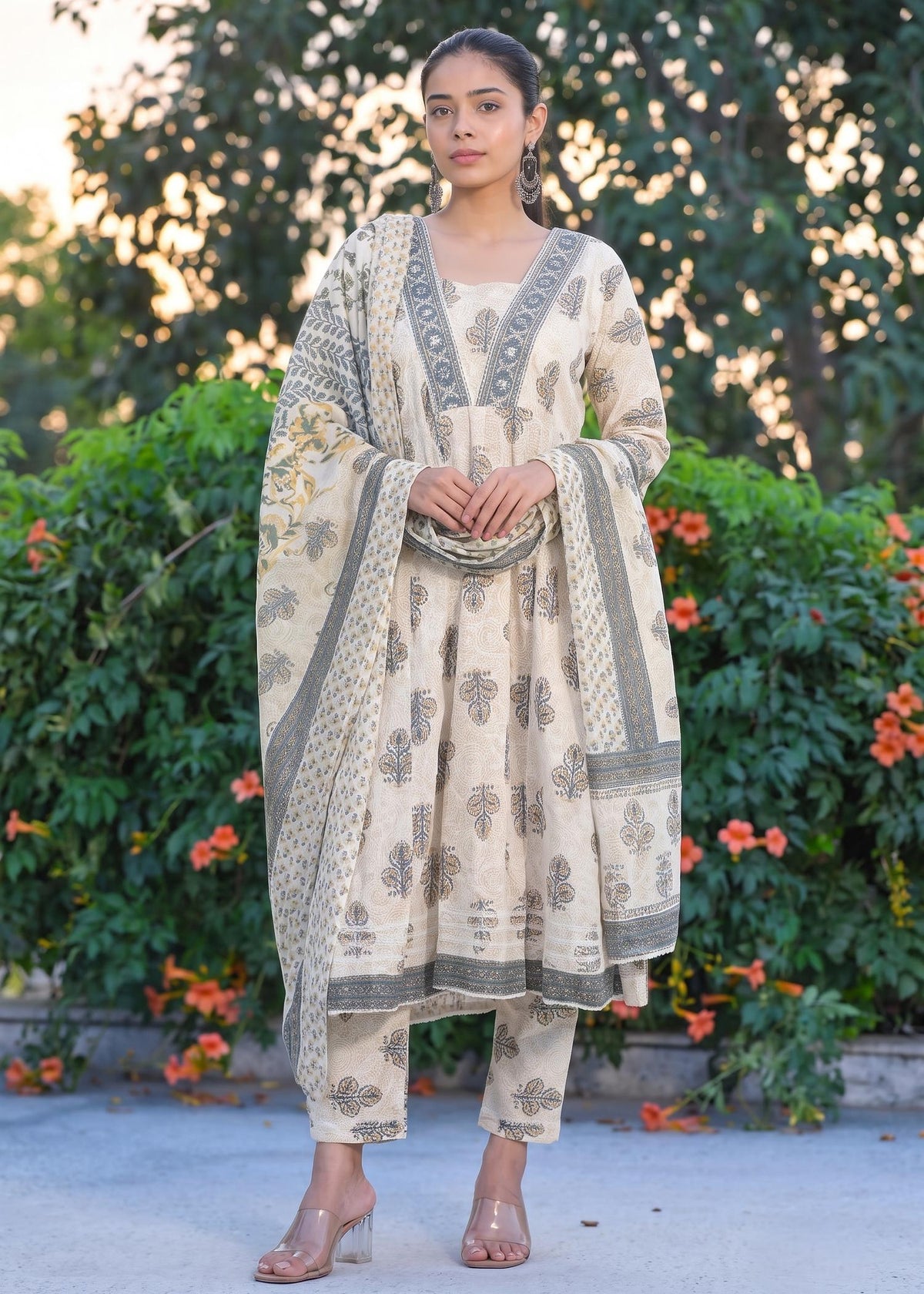 Woman wearing cream floral printed Anarkali suit set in plus size