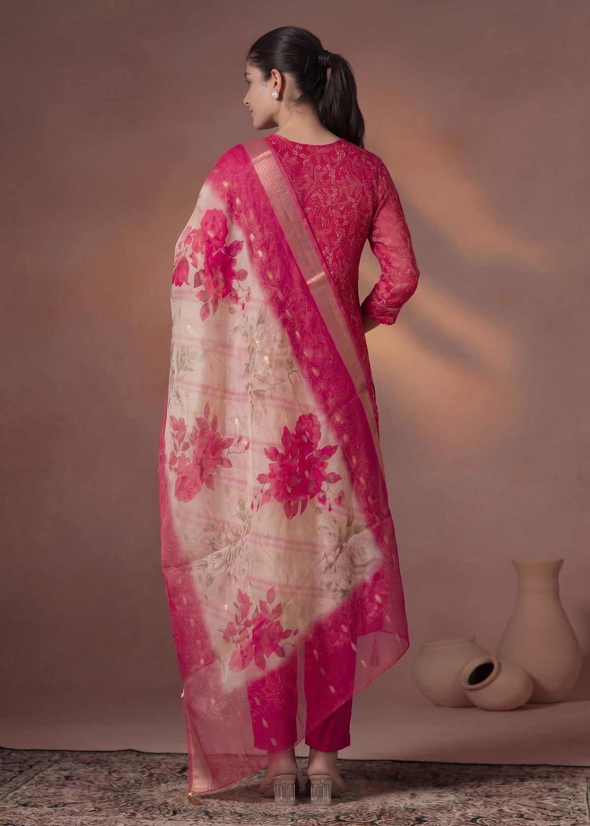 Pink kurta set with gold accents – back view with dupatta
