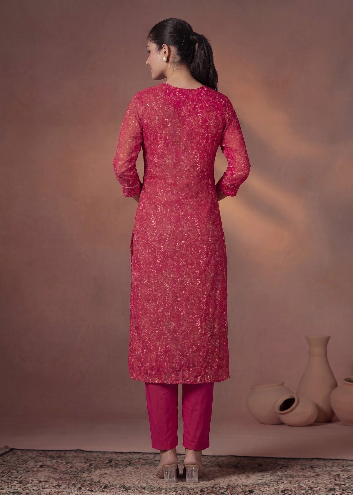 Pink kurta set with gold accents – back view